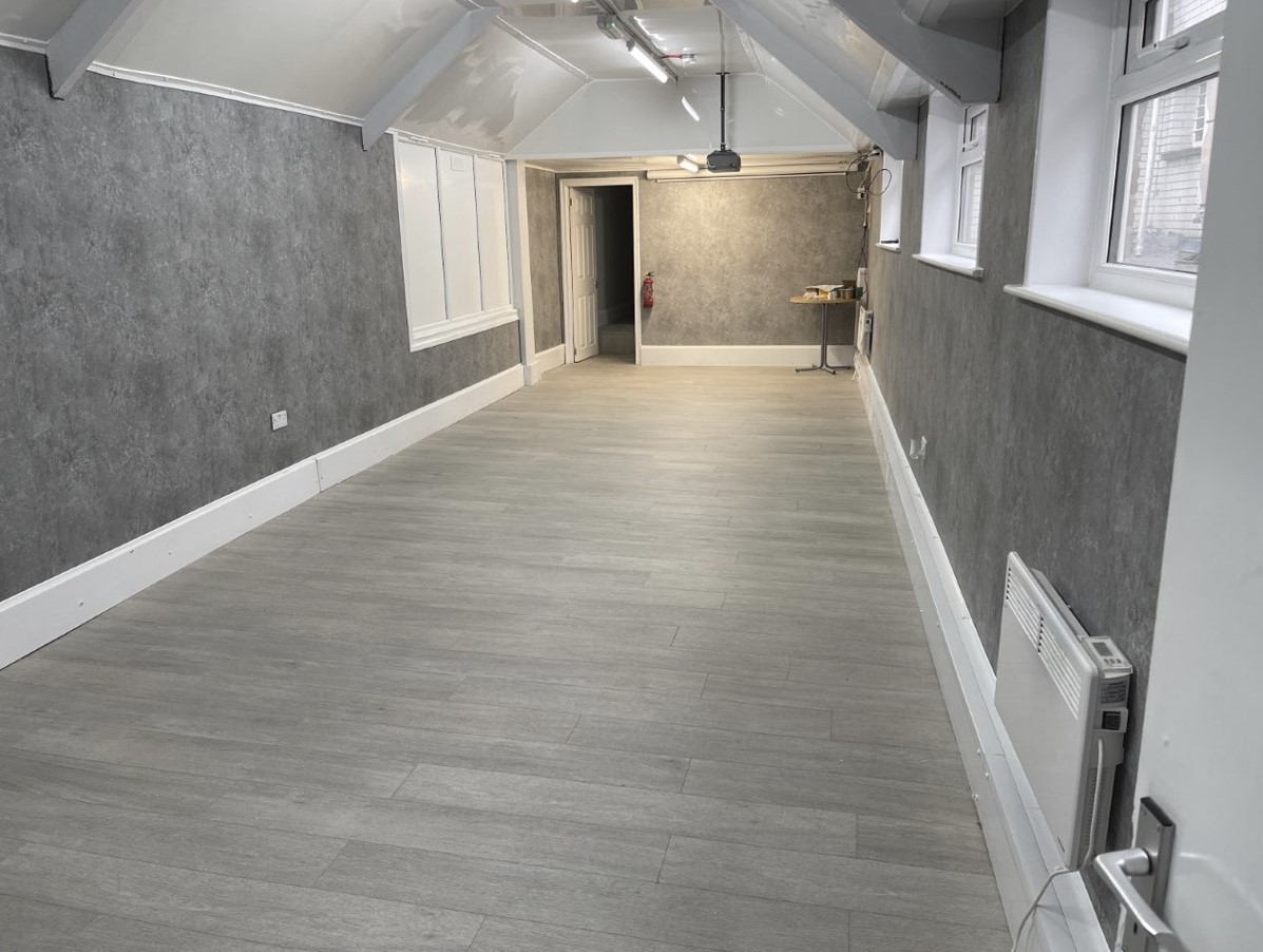 The first-floor function room at the Community Hub, laid out with chairs