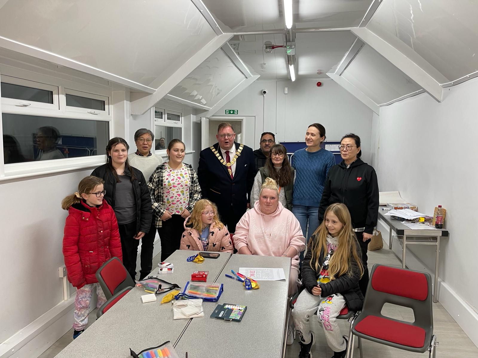 Young people and volunteers taking part in a youth club session at the Community Hub