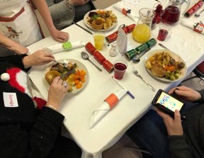 Volunteers preparing hot Christmas Day meals for delivery